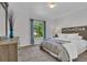 Bright bedroom featuring a large window with views, complemented by neutral walls and cozy carpet at 9758 Laredo St # 35B, Commerce City, CO 80022