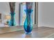 Close-up of a modern blue vase with artistic decorations, adding a touch of elegance to the bedroom's decor at 9758 Laredo St # 35B, Commerce City, CO 80022