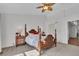 Bedroom with carpet, ceiling fan, and traditional wood bedframe and side tables at 9758 Laredo St # 35B, Commerce City, CO 80022