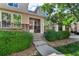 Charming townhome featuring stone accents, manicured landscaping, and a welcoming entrance at 9758 Laredo St # 35B, Commerce City, CO 80022
