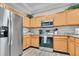 Well-appointed kitchen featuring stainless steel appliances and ample cabinet space at 9758 Laredo St # 35B, Commerce City, CO 80022