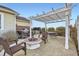 Outdoor patio with built-in grill, hot tub, fireplace, and a pergola at 4495 Windmill Dr, Brighton, CO 80601