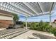 Backyard patio with pergola covering hot tub at 4495 Windmill Dr, Brighton, CO 80601