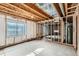 Unfinished basement with framing and a window, ready to be transformed into your dream space at 4495 Windmill Dr, Brighton, CO 80601