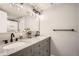 Elegant bathroom featuring a double vanity with granite countertop and a glass-enclosed shower at 4495 Windmill Dr, Brighton, CO 80601