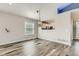 Dining room with modern flooring, recessed lighting, and a view into the kitchen at 4495 Windmill Dr, Brighton, CO 80601