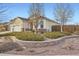 Well-maintained home featuring a three-car garage and beautifully landscaped front yard at 4495 Windmill Dr, Brighton, CO 80601