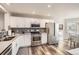 Well-equipped kitchen featuring stainless steel appliances, quartz counters, and ample lighting at 4495 Windmill Dr, Brighton, CO 80601