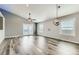 Bright living room features modern flooring, recessed lighting, and large windows at 4495 Windmill Dr, Brighton, CO 80601