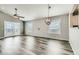 Bright living room features modern flooring, large windows, and modern light fixtures at 4495 Windmill Dr, Brighton, CO 80601