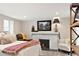 Charming bedroom with fireplace and comfortable seating area at 910 Steele St, Denver, CO 80206