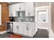 Bright, newly renovated kitchen with white cabinets and modern appliances at 910 Steele St, Denver, CO 80206