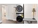 Convenient laundry area featuring a stackable washer and dryer unit at 910 Steele St, Denver, CO 80206