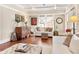 Bright living room with hardwood floors, white sofa, and neutral decor at 910 Steele St, Denver, CO 80206