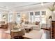 Bright living room with hardwood floors, fireplace, and comfortable seating at 910 Steele St, Denver, CO 80206