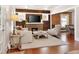 Cozy living room with hardwood floors and a brick fireplace at 910 Steele St, Denver, CO 80206