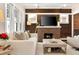 Stylish living room featuring hardwood floors, brick fireplace, and comfortable seating at 910 Steele St, Denver, CO 80206