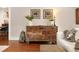 Classic living room featuring hardwood floors, dresser, and stylish decor at 910 Steele St, Denver, CO 80206