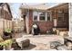 Charming brick patio with outdoor seating, perfect for relaxing or entertaining guests in style at 910 Steele St, Denver, CO 80206