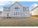 Backyard view with lawn and exterior of the home at 13694 Cherry St, Thornton, CO 80602