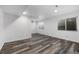 Basement with natural light and wood-style flooring at 13694 Cherry St, Thornton, CO 80602