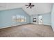 A spacious bedroom featuring a vaulted ceiling, a fireplace, and great natural light at 13694 Cherry St, Thornton, CO 80602