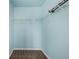 A walk in closet with white storage shelves and carpeted floor at 13694 Cherry St, Thornton, CO 80602