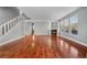Spacious living room with hardwood floors, fireplace and staircase to the second floor at 13694 Cherry St, Thornton, CO 80602