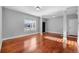 Bright living room with hardwood floors, neutral paint and ample natural light at 13694 Cherry St, Thornton, CO 80602