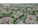 Wide aerial shot of a well-maintained residential neighborhood, filled with mature trees and manicured green spaces at 10087 E Hawaii Pl, Aurora, CO 80247