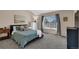 Comfortable bedroom filled with natural light, soft carpet, and stylish decor at 10087 E Hawaii Pl, Aurora, CO 80247