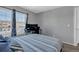 Bedroom featuring two windows and a workstation at 10087 E Hawaii Pl, Aurora, CO 80247