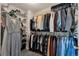 Well-organized walk-in closet with shelving and hanging space for clothes and accessories at 10087 E Hawaii Pl, Aurora, CO 80247