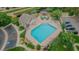 Aerial shot of a beautiful community pool area with lounge chairs, greenery, and shaded gazebo at 10087 E Hawaii Pl, Aurora, CO 80247