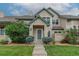 Inviting front entrance with a well-manicured lawn and mature landscaping, creating a welcoming atmosphere at 10087 E Hawaii Pl, Aurora, CO 80247