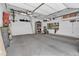 Garage featuring storage shelves, snowboard, and lots of room at 10087 E Hawaii Pl, Aurora, CO 80247