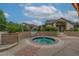 Charming hot tub surrounded by brickwork and lush landscaping, perfect for relaxation at 10087 E Hawaii Pl, Aurora, CO 80247