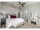 Bright bedroom with vaulted ceilings, a cozy bed, a vanity, and neutral tones at 9758 Laredo St # 37C, Commerce City, CO 80022