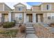 Attractive townhome exterior showcasing stone accents, siding, and a well-maintained front yard, creating a welcoming curb appeal at 9758 Laredo St # 37C, Commerce City, CO 80022