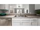 Bright kitchen featuring white cabinets, stainless steel appliances, and modern fixtures at 9758 Laredo St # 37C, Commerce City, CO 80022