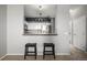Modern kitchen with white cabinetry, stainless steel appliances, and an open layout at 9758 Laredo St # 37C, Commerce City, CO 80022