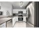 Well-equipped kitchen with stainless steel appliances and white cabinetry at 9758 Laredo St # 37C, Commerce City, CO 80022