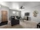 Inviting living room with carpet, neutral walls, and a ceiling fan for added comfort at 9758 Laredo St # 37C, Commerce City, CO 80022