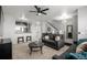 Spacious living room with carpet, neutral walls, and an open layout to the kitchen at 9758 Laredo St # 37C, Commerce City, CO 80022