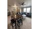 Open-concept living space with dining area, living room, and staircase at 9758 Laredo St # 37C, Commerce City, CO 80022