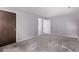 Spacious bedroom with neutral walls and plush carpeting, showcasing a comfortable and inviting atmosphere at 2212 S Naples Way, Aurora, CO 80013
