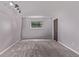 This comfortable bedroom has large window which provides natural light and gray carpet at 2212 S Naples Way, Aurora, CO 80013