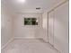 Comfortable bedroom with a large window, carpet, and a spacious closet at 2212 S Naples Way, Aurora, CO 80013