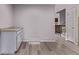 Cozy dining area with light-colored walls, vinyl floors, and a view of the stairway at 2212 S Naples Way, Aurora, CO 80013