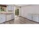 Kitchen featuring stainless steel dishwasher and sink plus glass doors to the backyard at 2212 S Naples Way, Aurora, CO 80013